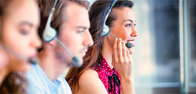 A smiling girl dispatcher receives a call 