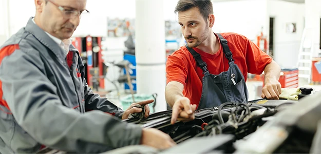 Victory Truck Shop mechanics repairing a car