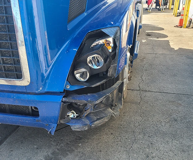 Blue truck after a collision